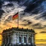 A German flag atop the Reichstag building in Berlin.