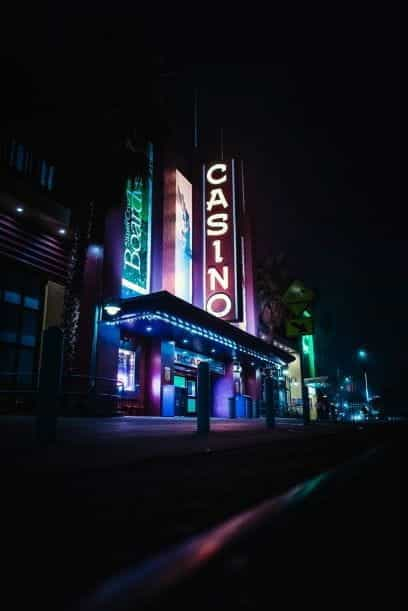 A neon casino sign at night.